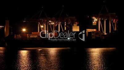 Port warehouse with cargoes and containers at night. Odessa, Ukraine