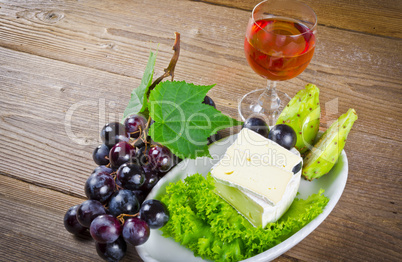 cheese and bunches of grapes cheese and bunches of grapes