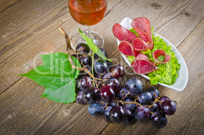 pepper salami and bunches of grapes