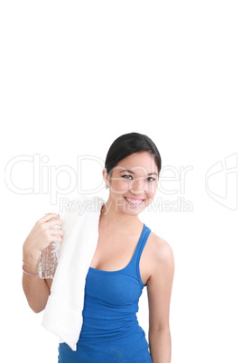 portrait of woman in fitness attire holding water bottle and smi