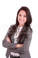 portrait of a happy young business woman standing with folded ha