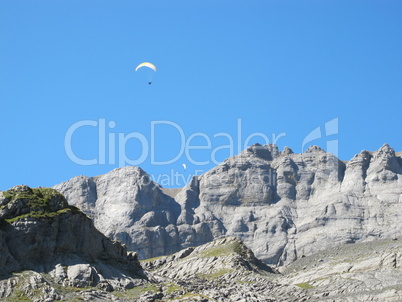 Paraglider Over The Mountains Of Glarus
