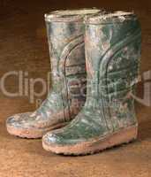 green dirty rubber boots