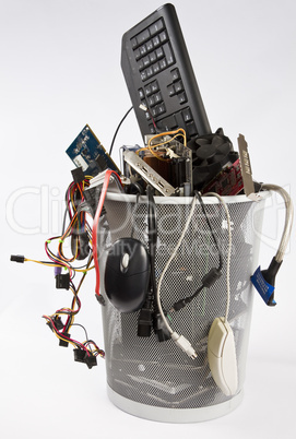 electronic scrap in trash can