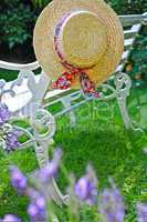 Peacuful summer garden with a hat