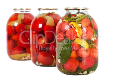 red tomatoes in a glass jar