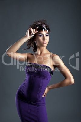 young woman with amazing figure take off glasses