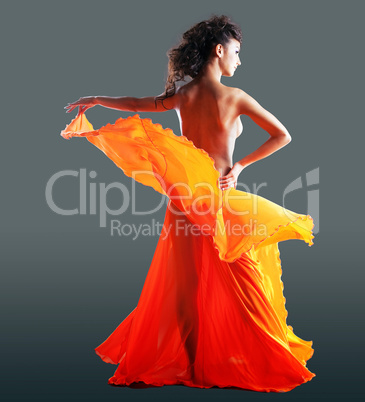 beauty naked woman dance in orange veil