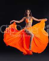 beauty dancer posing in orange veil - arabia style