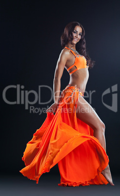 beauty naked woman posing in orange veil
