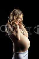 Beauty nude blond pregnant woman close breast
