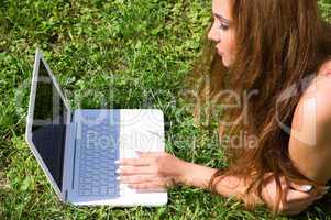 Beautiful girl with a laptop outdoor