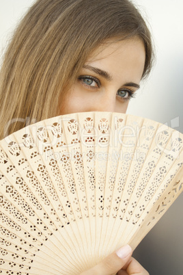 Beautiful Young Woman with a Fan