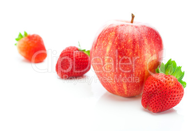 big juicy red ripe strawberries and apple isolated on white