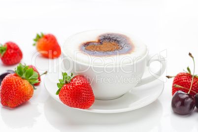 cappuccino in a cup in the shape of hearts,cherry  and strawberr
