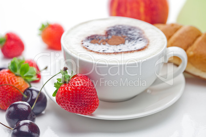 cappuccino in a cup in the shape of hearts,cherry,croissant and