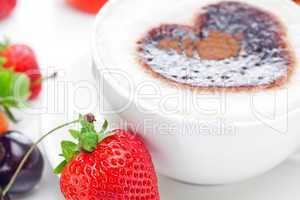 cappuccino in a cup in the shape of hearts,cherry,croissant and