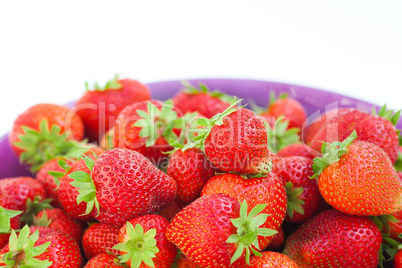 strawberries in a glass plate isolated on white