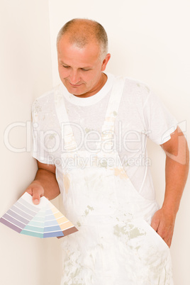 Home decorating mature male painter color swatches