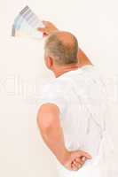 Home decorating mature male painter color swatches