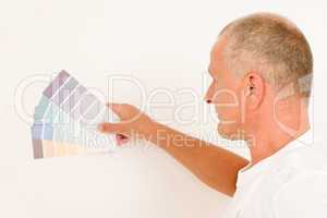 Home decorating mature male painter color swatches