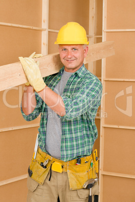 Handyman carpenter mature carry wooden beam