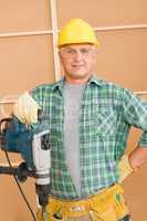 Handyman home improvement working with jackhammer