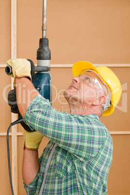 Handyman home improvement working with jackhammer