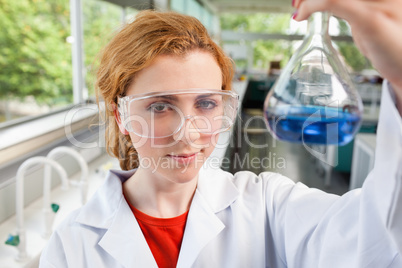 Science student holding a flask