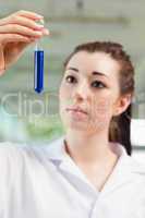 Portrait of a student looking at a test tube