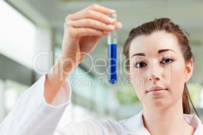 Cute student holding a test tube