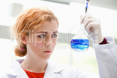 Science student mixing liquids
