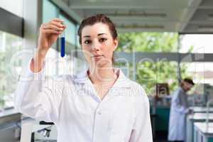 Beautiful scientist holding a test tube