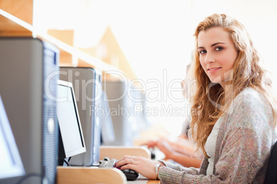 Student posing with a computer Student posing with a computer