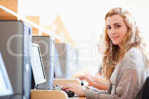 Student posing with a computer