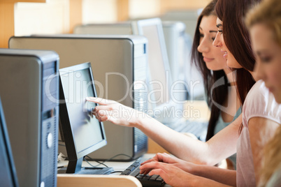 Student pointing at something to her friend