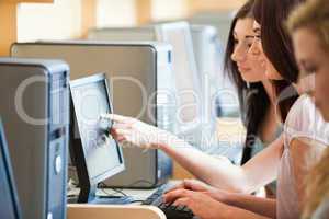 Student pointing at something to her friend