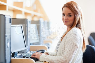 Young student posing with a computer