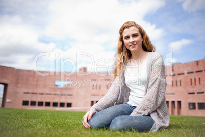 Young woman sitting on a lawn