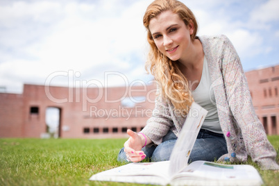 Woman posing with a book