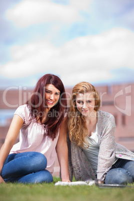 Portrait of young students with a book