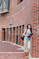 Portrait of a smiling woman with a binder