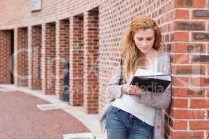 Young student reading her notes