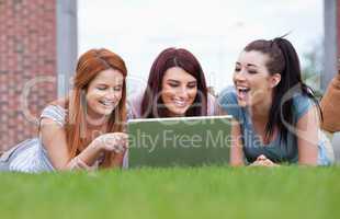 Happy women using a notebook