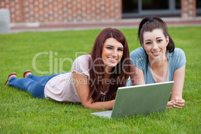 Friends using a notebook