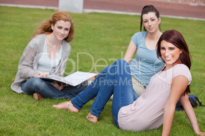 Young women sitting on the lawn