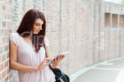 Focused student using a tablet computer