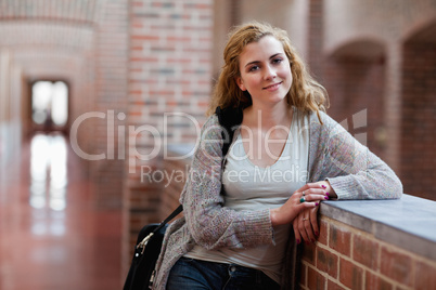 Lovely young student standing up