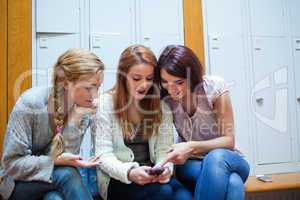 Student showing a text message to her friends