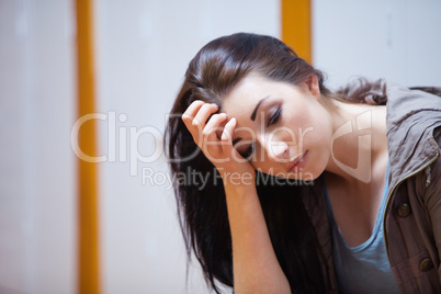 Lonely student with her head on her hand